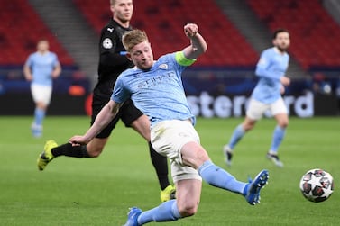 TOPSHOT - Manchester City's Belgian midfielder Kevin De Bruyne shoots, but has his shot saved during the UEFA Champions League, last 16, second-leg football match between Manchester City and Borussia Monchengladbach at the Puskas Arena in Budapest on March 16, 2021. / AFP / Attila KISBENEDEK