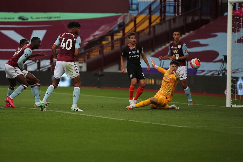 Aston Villa's Kortney Hause, left, scores his side's opening goal during the match against Aston Villa at the Villa Park on Sunday. AP