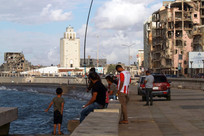 People gather at a seaside promenade in Libya's eastern city of Benghazi. AFP