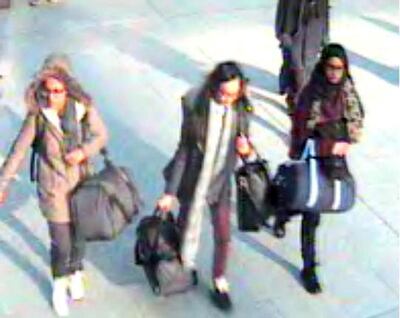 FILE -  In this still taken from CCTV issued by the Metropolitan Police in London on Feb. 23, 2015,  15-year-old Amira Abase, left,  Kadiza Sultana,16, center, and Shamima Begum, 15, walk through Gatwick airport, south of London, before catching their flight to Turkey on Tuesday Feb 17, 2015. The three teenage girls left the country in a suspected bid to travel to Syria to join the Islamic State extremist group. When the three British schoolgirls trundled across the Syrian border they were going to a place of no return. Only two of the approximately 600 Western girls and young women who have joined extremists in Syria are known to have made it out of the war zone. (AP Photo/Metropolitan Police, File) NO ARCHIVE