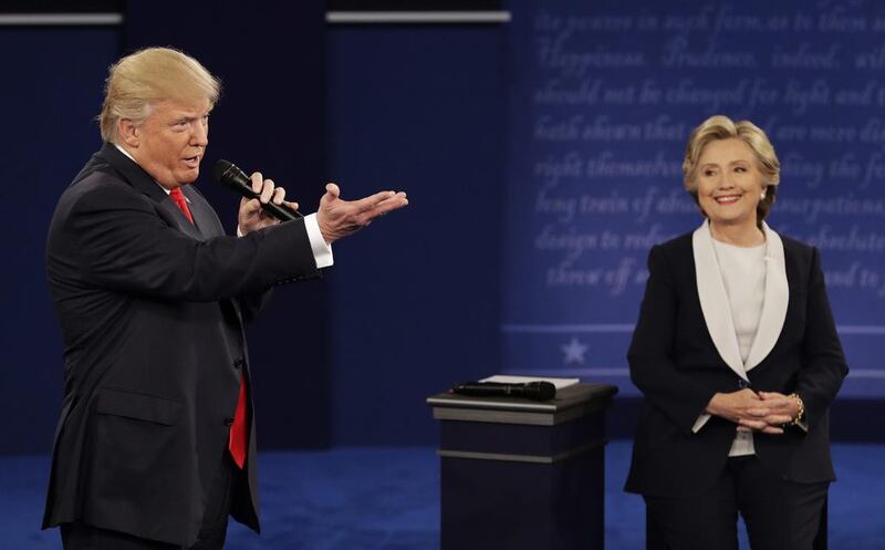 The US presidential candidates Donald Trump and Hillary Clinton have both embraced dishonesty in their quest to reach the top of the American political ladder. John Locher / AP Photo