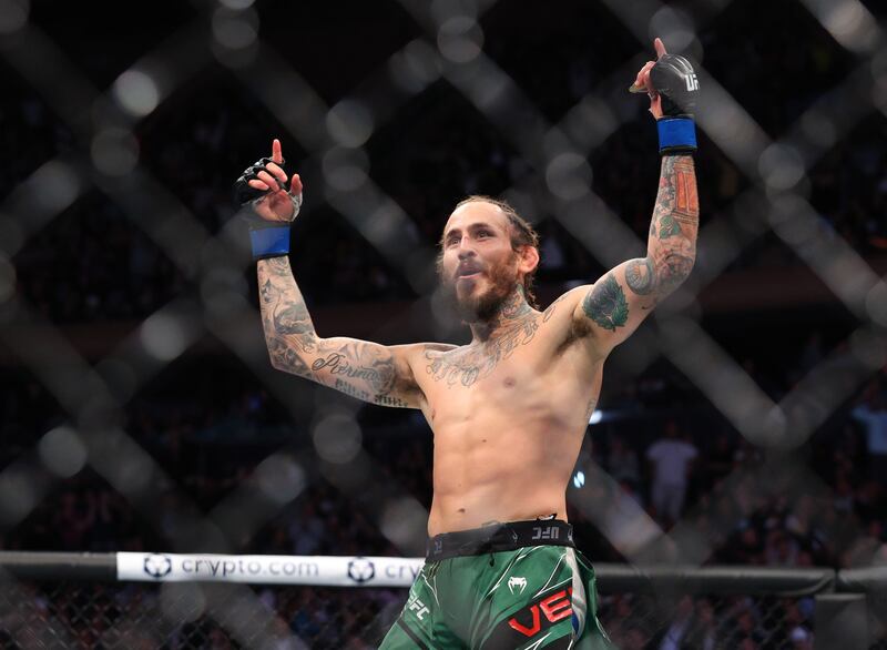 Marlon Vera (blue gloves) celebrates after defeating Frankie Edgar at UFC 268. Reuters