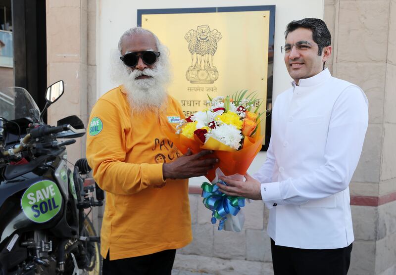 Consul general of India Dr Aman Puri, right, greets Indian spiritual leader Sadhguru in Dubai.