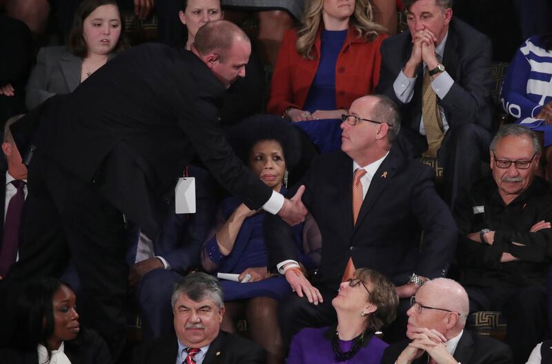 Fred Guttenberg, father of Parkland school shooting victim Jaime Guttenberg, is ejected after shouting during US President Donald Trump's State of the Union address to a joint session of the US Congress in the House Chamber of the US Capitol in Washington. Reuters