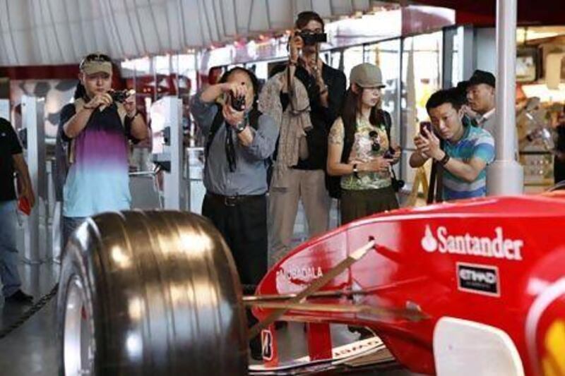 Chinese tour operators visit Ferrari World yesterday as part of their tour of Abu Dhabi's top tourist destinations. Antonie Robertson / The National