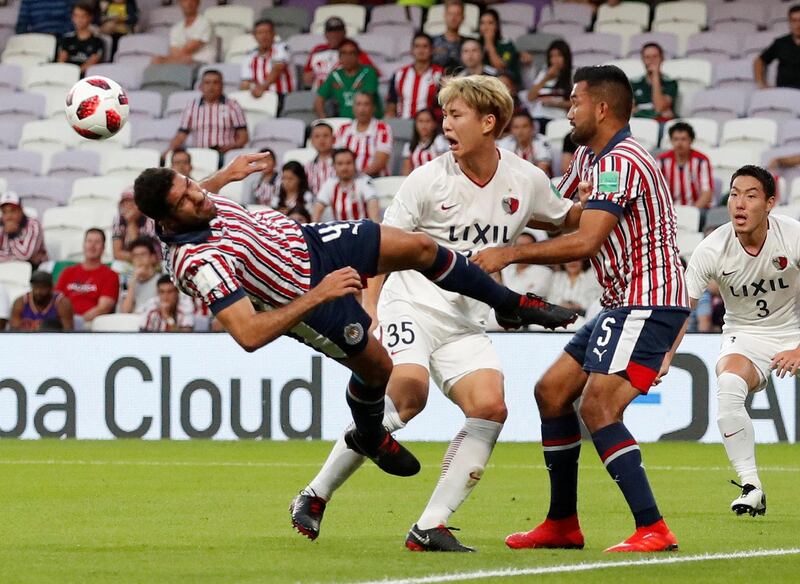 Kashima Antlers' Jung Seung-hyun in action with Guadalajara's Jair Pereira and Marin. Reuters