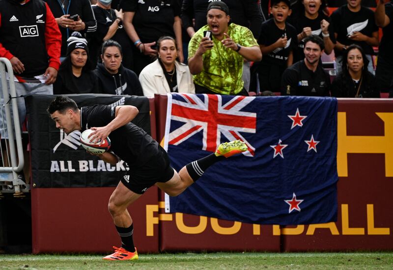 Damian McKenzie of the All Blacks dives to score a try. AFP