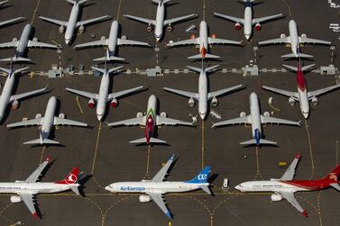 Boeing 737 MAX air planes are seen parked in Seattle. The grounded plane may take its certification flight in October. AFP