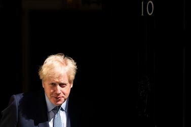 British Prime Minister Boris Johnson waits outside his London residence; UK police chiefs have put pressure on the UK leader to adopt a controversial new definition of Islamophobia EPA