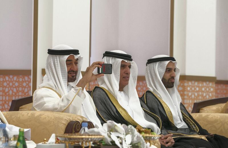 ADHAN, RAS AL KHAIMAH, UNITED ARAB EMIRATES - March 13, 2018: HH Sheikh Mohamed bin Zayed Al Nahyan, Crown Prince of Abu Dhabi and Deputy Supreme Commander of the UAE Armed Forces (L), attends a mass wedding reception for HH Sheikh Mohamed bin Saud bin Saqr Al Qasimi, Crown Prince and Deputy Ruler of Ras Al Khaimah (R), at Mohamed bin Zayed, Al Bayt Mitwahid wedding hall. Seen with HH Sheikh Saud bin Saqr Al Qasimi, UAE Supreme Council Member and Ruler of Ras Al Khaimah (C).

( Mohamed Al Hammadi / Crown Prince Court - Abu Dhabi )
---