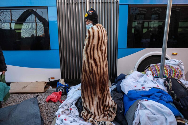 Colombian immigrant Manuel, 21, gets up after sleeping outside a migrant shelter in El Paso, Texas. Getty / AFP