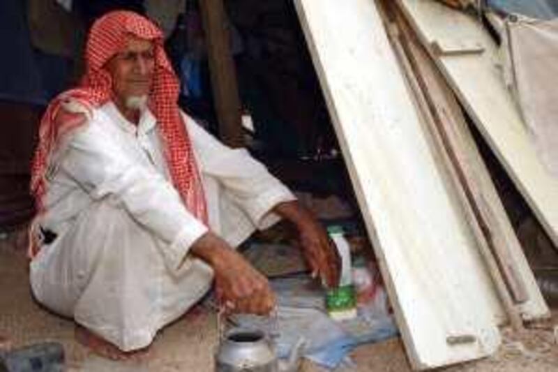 An old Saudi setting in front of his shanty home that is made of tinplates. 
Khidir al Zahrani BUT HE DOES NOT WANT A CREDIT
THIS IS THE CREDIT
Special for The National                         *** Local Caption ***  DSC_0059.jpg