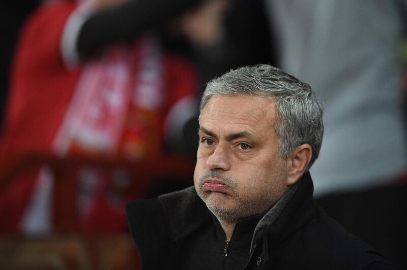 TOPSHOT - Manchester United's Portuguese manager Jose Mourinho looks on during the start of a last 16 second leg UEFA Champions League football match between Manchester United and Sevilla at Old Trafford in Manchester, northwest England on March 13, 2018. / AFP PHOTO / Oli SCARFF