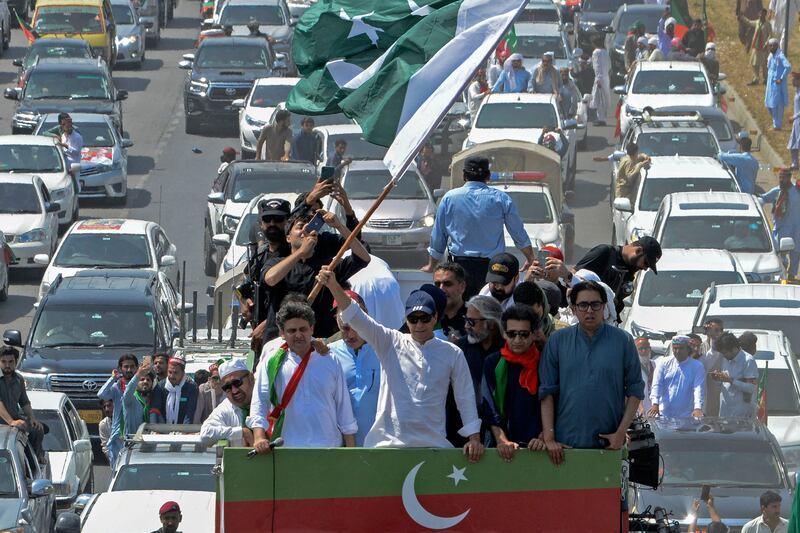 Imran Khan and supporters in Swabi. AFP