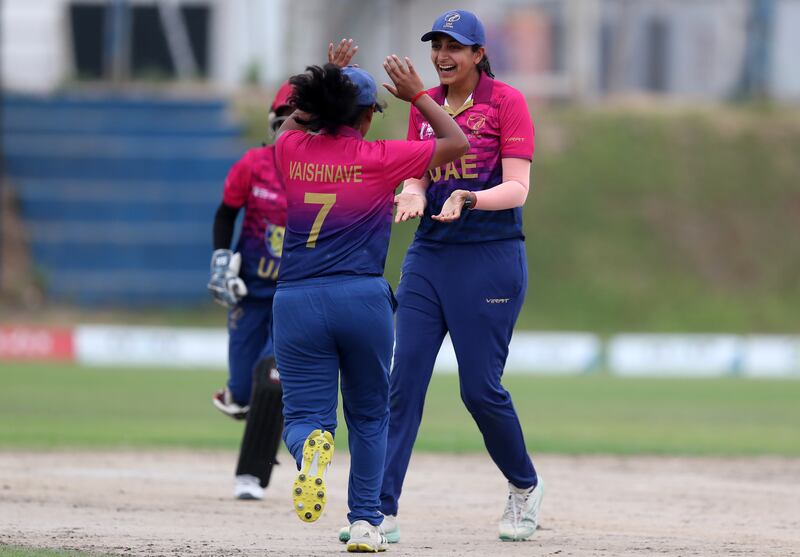 The UAE's Esha Oza celebrates after taking the wicket of Western Storm's Niamh Holland. 