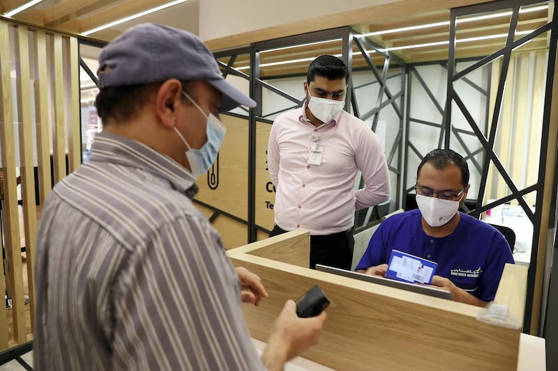 DUBAI, UNITED ARAB EMIRATES , October 14 – 2020 :- People taking their token for the COVID-19 nasal swab test at the COVID 19 testing station set up at Mall of the Emirates in Dubai. (Pawan Singh / The National) For News/Online. Story by Sarwat