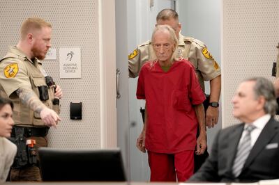 Joseph Czuba is escorted into a Will County, Illinois, courtroom for his arraignment. AP