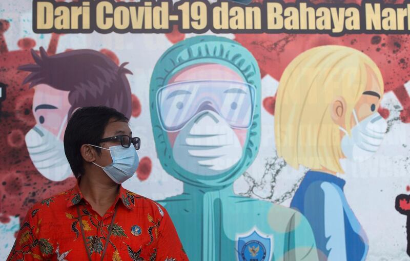 A mural  in Denpasar, Bali, to spread awareness about the prevention of the coronavirus in Indonesia. AP Photo