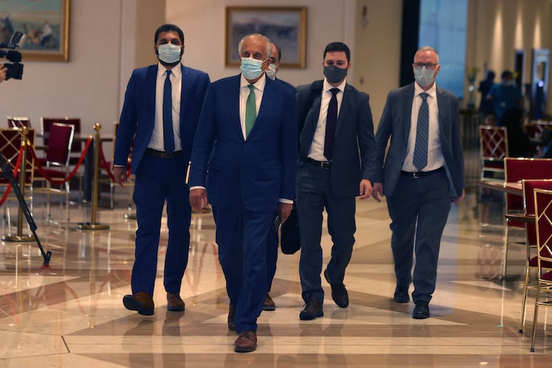 US special envoy for Afghanistan Zalmay Khalilzad (2nd L) arrives at a hotel in Qatar's capital Doha for a meeting on the escalating conflict in Afghanistan, on August 10, 2021. AFP
