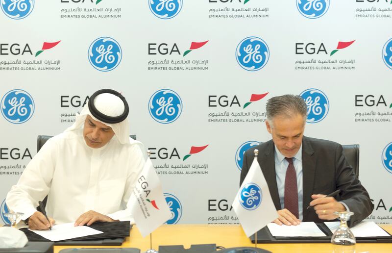 EGA and GE officials sign the agreement to upgrade four GE turbines at EGA's Al Taweelah power plant. Photo: EGA