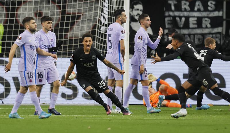 Ansgar Knauff of Frankfurt celebrates with teammate Tuta after scoring the opening goal in the Europa League quarter-final first leg against Barcelona. EPA