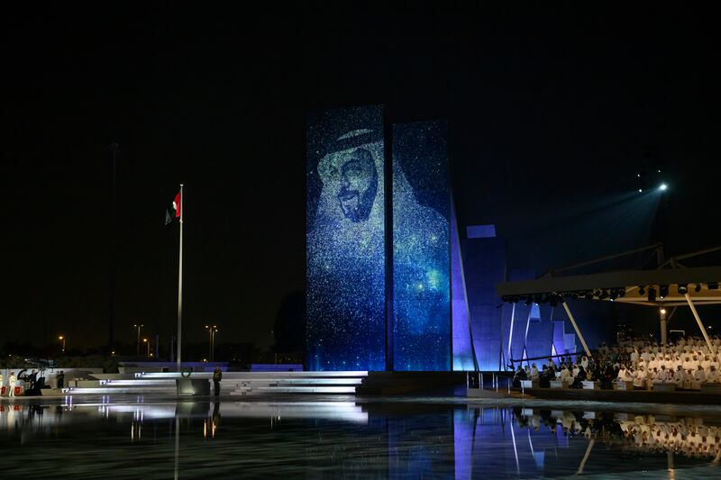 An image of President Sheikh Khalifa on the monument at Wahat Al Karama.