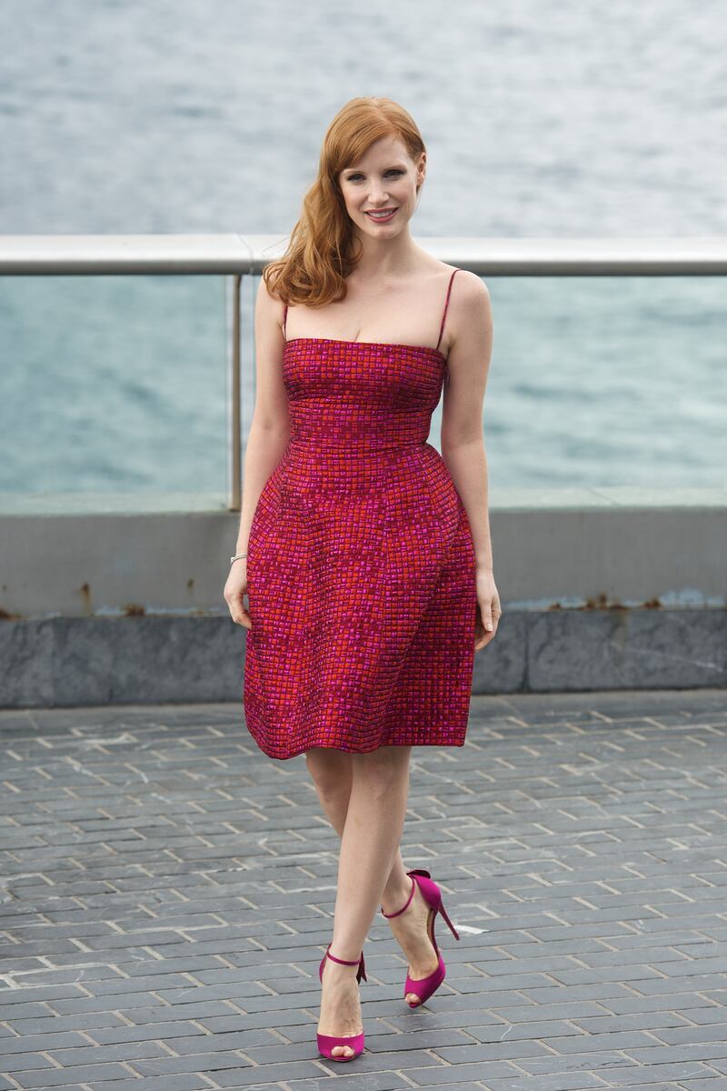 Jessica Chastain, in a crimson lace dress, attends a photocall for 'The Disappearance of Eleanor Rigby' crew during the 62nd San Sebastian International Film Festival on September 23, 2014 in Spain. Getty Images