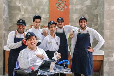 (L-R) Saeed Al Ameri, Khalid Waleed Mohammed, Mansoor Al Hammadi, Salim Al Tamami, Mohammed Al Haj and Hazza Al Muhairbi are the employees behind The Bee Cafe. Victor Besa / The National 