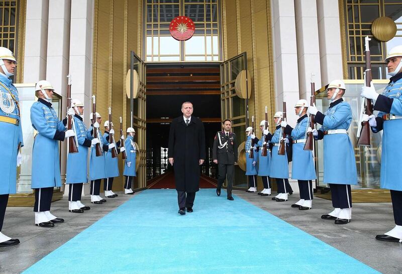 Turkey's president Tayyip Erdogan, centre, at a welcoming ceremony at the presidential palace in Ankara on March 12, 2015. Kayhan Ozer/Presidential palace press office handout via Reuters (