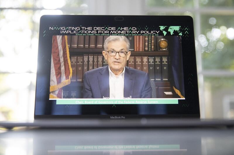 Jerome Powell, chairman of the U.S. Federal Reserve, speaks during the Jackson Hole economic symposium seen on a laptop computer in Tiskilwa, Illinois, U.S., on Thursday, Aug. 27, 2020. This year investors can listen directly during the Federal Reserve Bank of Kansas City's annual event because it will be conducted virtually due to the coronavirus pandemic and streamed live to the public for the first time. Photographer: Daniel Acker/Bloomberg