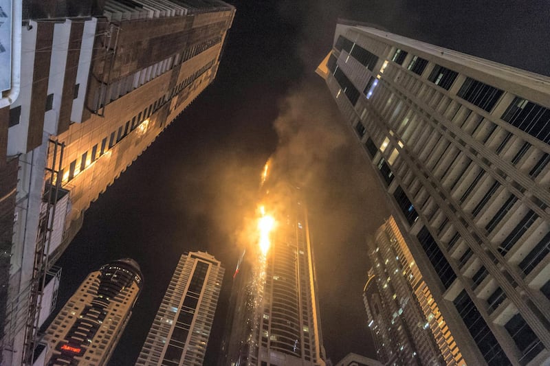 DUBAI. UNITED ARAB EMIRATES, 04 AUGUST 2017. A massive fire rips through The Marina Torch tower's southern corner. (Photo: Antonie Robertson) Journalist: None. Section: National.