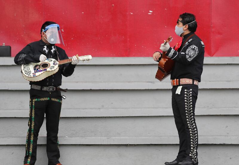 Musicians from Mariachi groups perform during an event to appeal that authorities allow them to work this upcoming Mother's Day in Quito, Ecuador.  AP