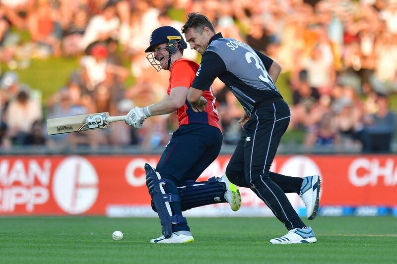 New Zealand's captain Tim Southee, right, collides with England counterpart Eoin Morgan. AFP