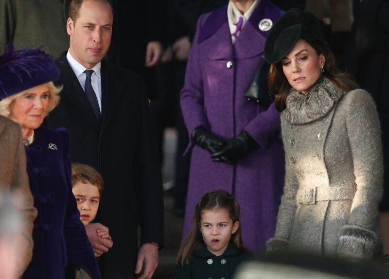 Britain's Prince William, Duke of Cambridge, second left, Catherine, Duchess of Cambridge, right, and their children Prince George and Princess Charlotte arrive to attend the Christmas day service at St Mary Magdalene Church in Sandringham. AP