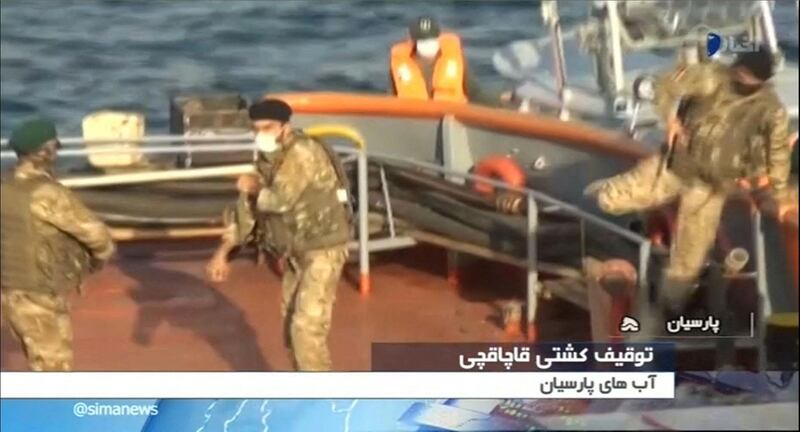 This image grab taken from a broadcast by Islamic Republic of Iran Broadcasting (IRIB) on November 20, 2021 reportedly shows Iran's Revolutionary Guards seizing a diesel-smuggling boat in Gulf waters. IRIB / AFP