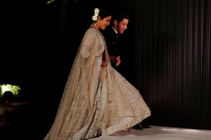 Newlyweds Priyanka Chopra, 36, and Nick Jonas, 26, pose for a photograph during a reception at a hotel in New Delhi on December 4, 2018. Photo: AFP