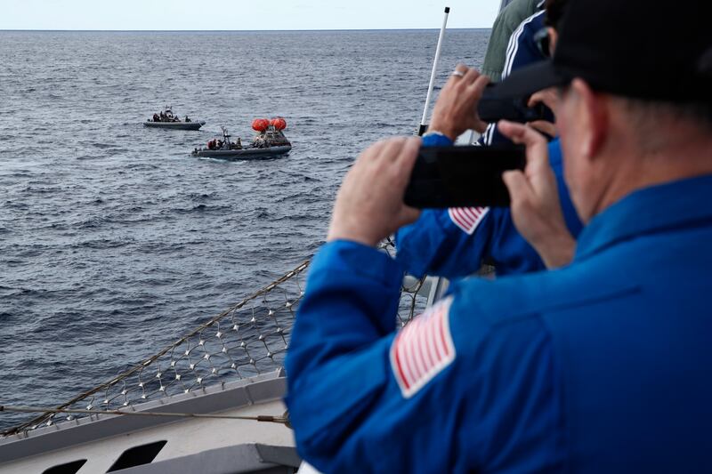 Flight surgeons from the Johnson Space Centre follow the recovery mission. EPA