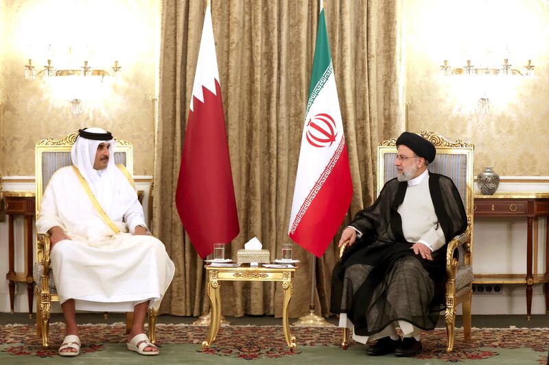 Mr Raisi and Sheikh Tamim come together for a meeting in Tehran. Reuters