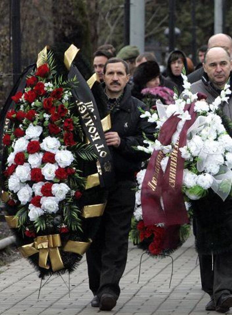 Friends and relatives take part in the funeral ceremony of Sergei Magnitsky in Moscow earlier this month.