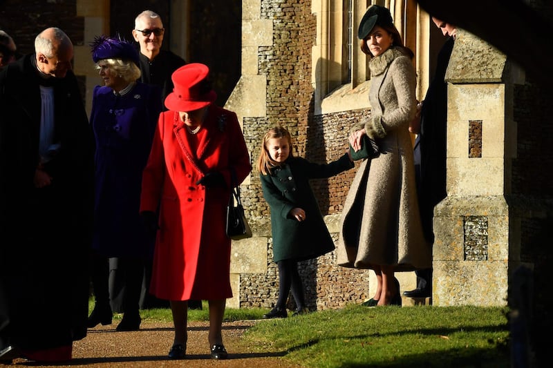 From left: Britain's Queen Elizabeth II, Britain's Princess Charlotte of Cambridge and Britain's Catherine, Duchess of Cambridge leave after the Royal Family's traditional Christmas Day service at St Mary Magdalene Church in Sandringham. AFP