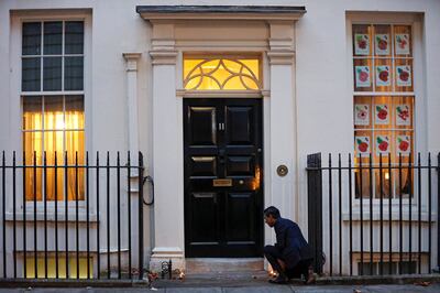 Rishi Sunak lights candles outside Downing Street for the Hindu festival of Diwali last year. Reuters