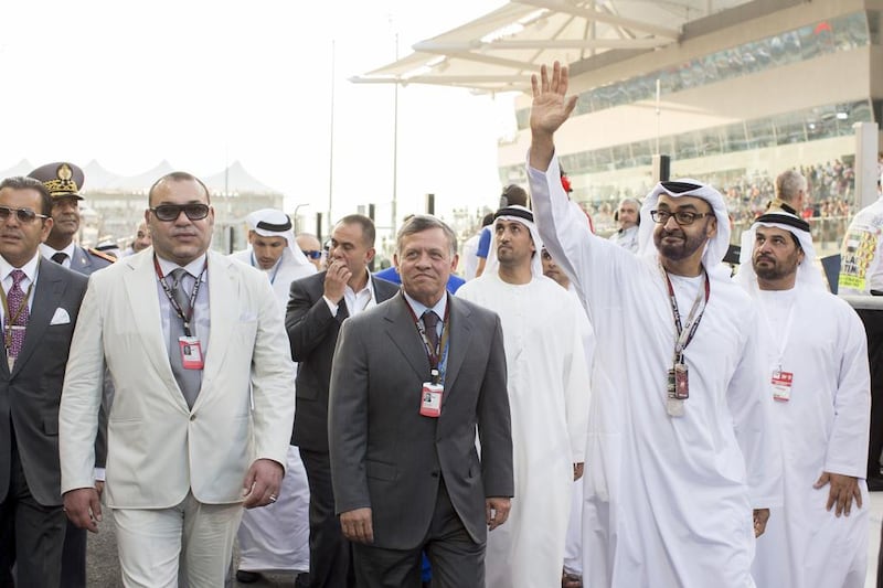 King Abdullah II of Jordan, and King Mohammed VI of Morocco (L), walk the pit lane with Sheikh Mohamed before the final race of the 2014 Formula 1 season in Abu Dhabi. Ryan Carter / Crown Prince Court — Abu Dhabi
