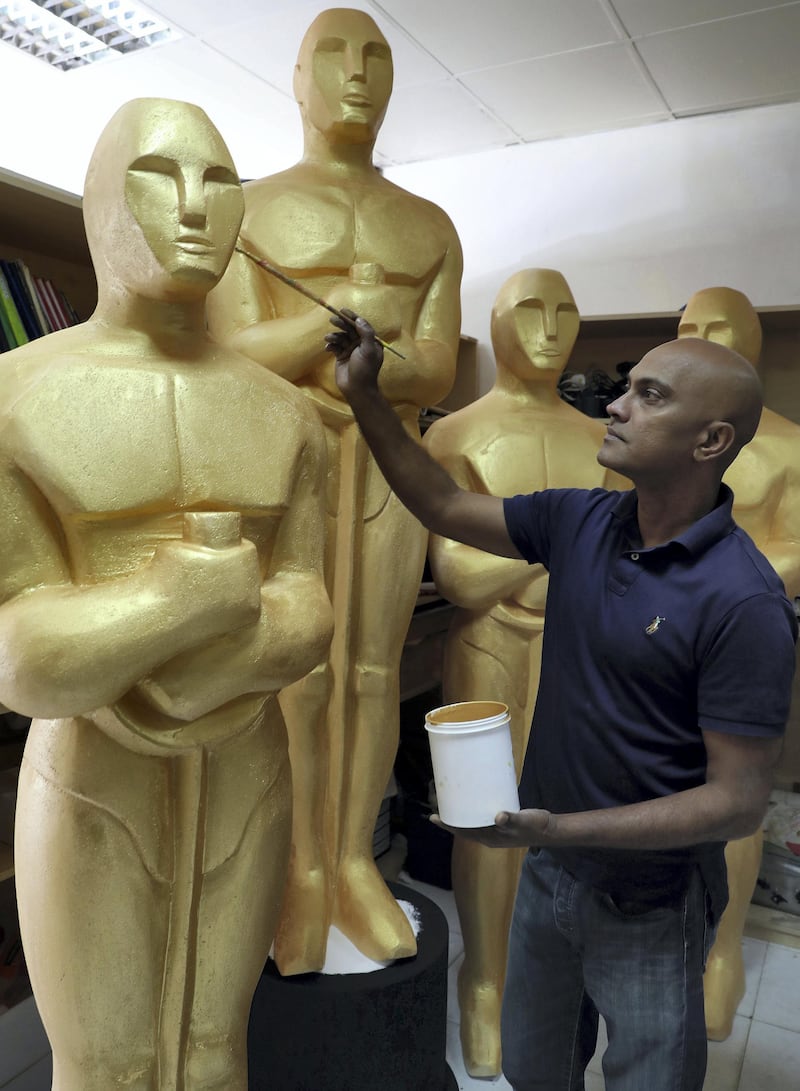 Dubai, United Arab Emirates - January 10th, 2018: Photo project. Sculptor Mark Ranasinghe applies the final touches to his giant oscar sculptures made out of polystyrene. Wednesday, January 10th, 2018 at Al Quoz, Dubai. Chris Whiteoak / The National