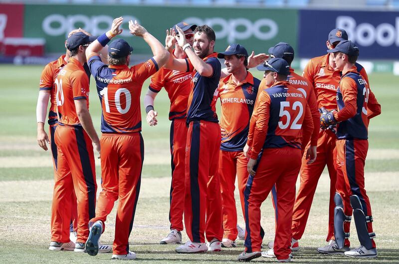 DUBAI, UNITED ARAB EMIRATES , October 29  – 2019 :- Paul van Meekeren of Netherlands ( center ) celebrating after taking the wicket of Rameez Shahzad during the World Cup T20 Qualifier between UAE vs Netherlands held at Dubai International Cricket Stadium in Dubai.  ( Pawan Singh / The National )  For Sports. Story by Paul