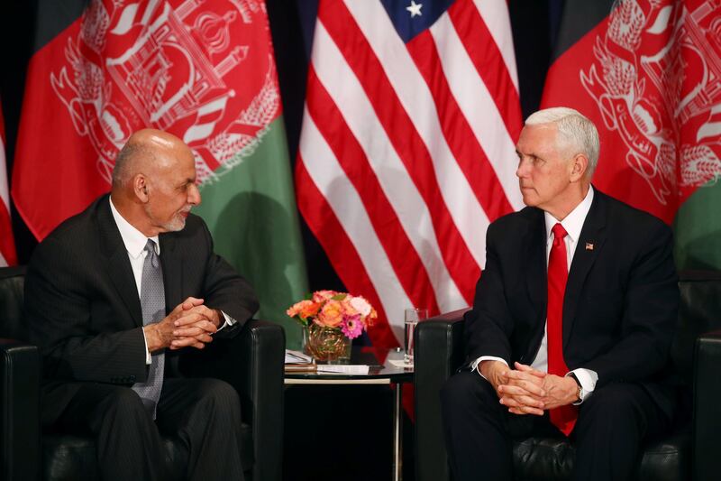 Ashraf Ghani and Mike Pence attend a meeting. Reuters