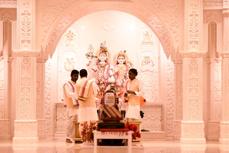 The new Hindu temple, decorated in colourful flowers, is a contemporary spiritual hub.  
