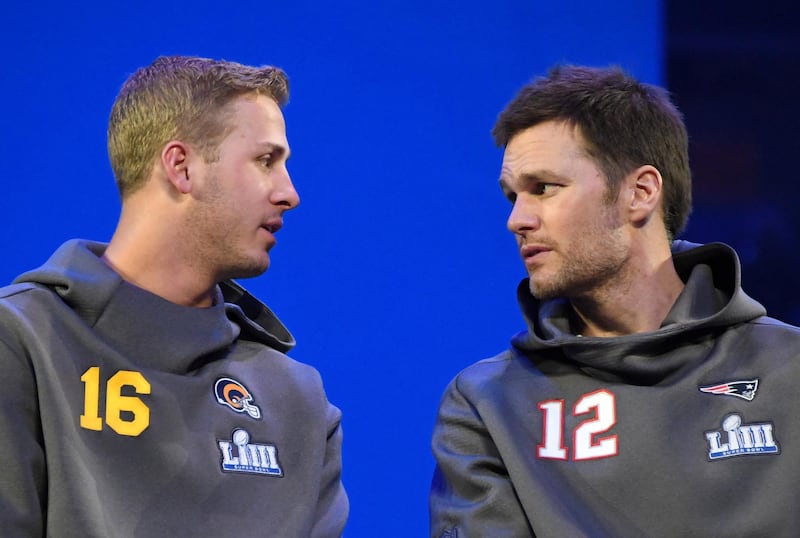FILE PHOTO: Jan 28, 2019; Atlanta, GA, USA; Los Angeles Rams quarterback Jared Goff (16) and New England Patriots quarterback Tom Brady (12) during Opening Night for Super Bowl LIII at State Farm Arena.  REUTERS/Mandatory Credit: Kirby Lee-USA TODAY Sports/File Photo