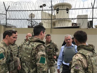 Ambassador Laurie Bristow, second right, was at the centre of Britain's evacuation efforts in Kabul. Reuters