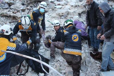 A White Helmets team pulls a person from the rubble as the search for survivors continues in Al Atareb, Syria. Reuters