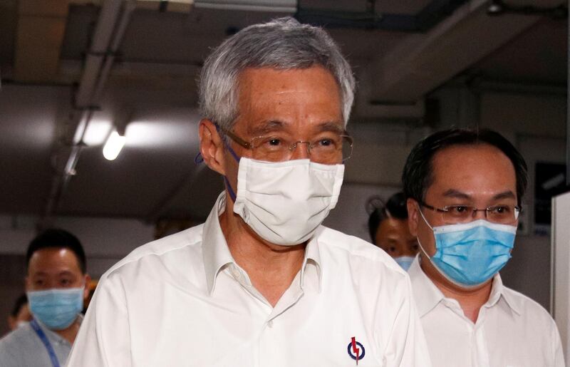 Singapore's Prime Minister Lee Hsien Loong arrives at a People's Action Party branch office, as ballots are counted during the general election, in Singapore on Friday. Reuters